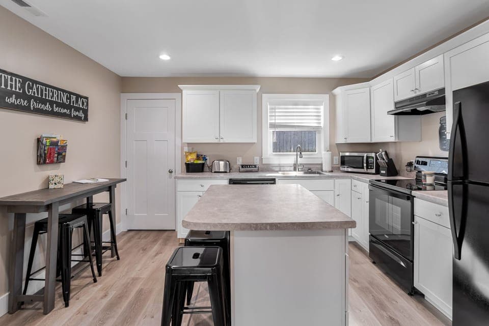 New kitchen with island, & automatic ice maker.