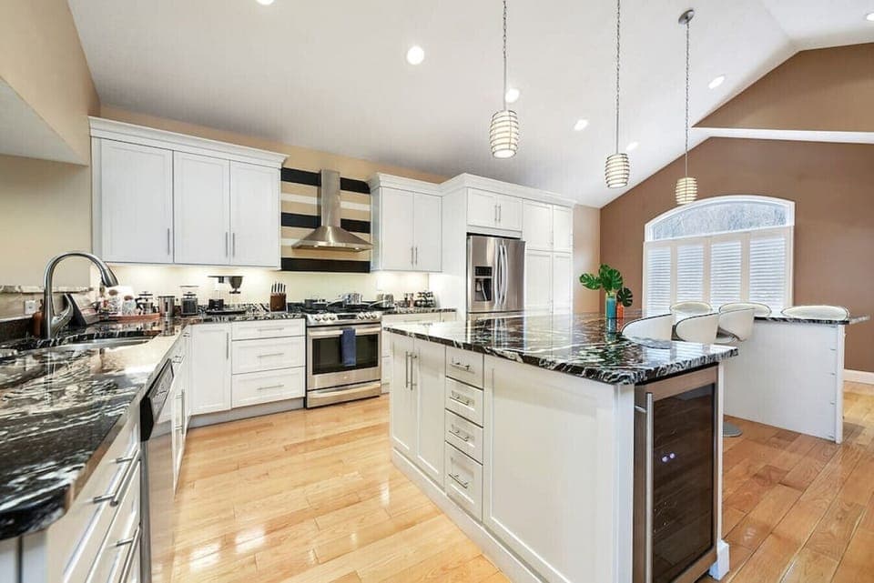 The massive kitchen is well stocked with everything you need to cook for your group. Cuisinart pots & pans, sharp knives, wine fridge, spice rack, blender, toaster, and more!