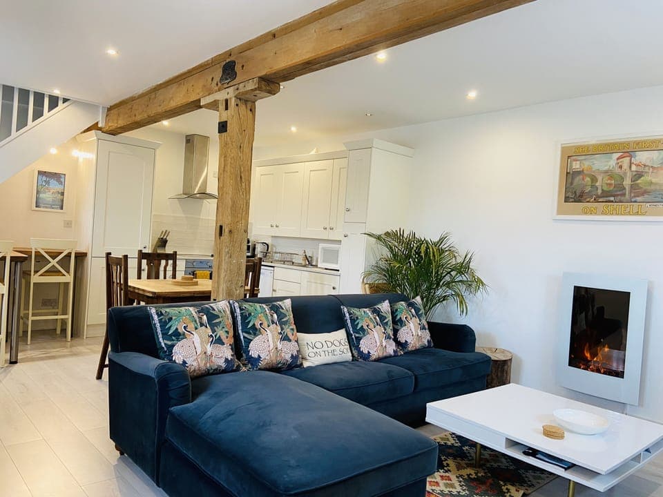 The newly renovated open plan living room, dining room and kitchen area.