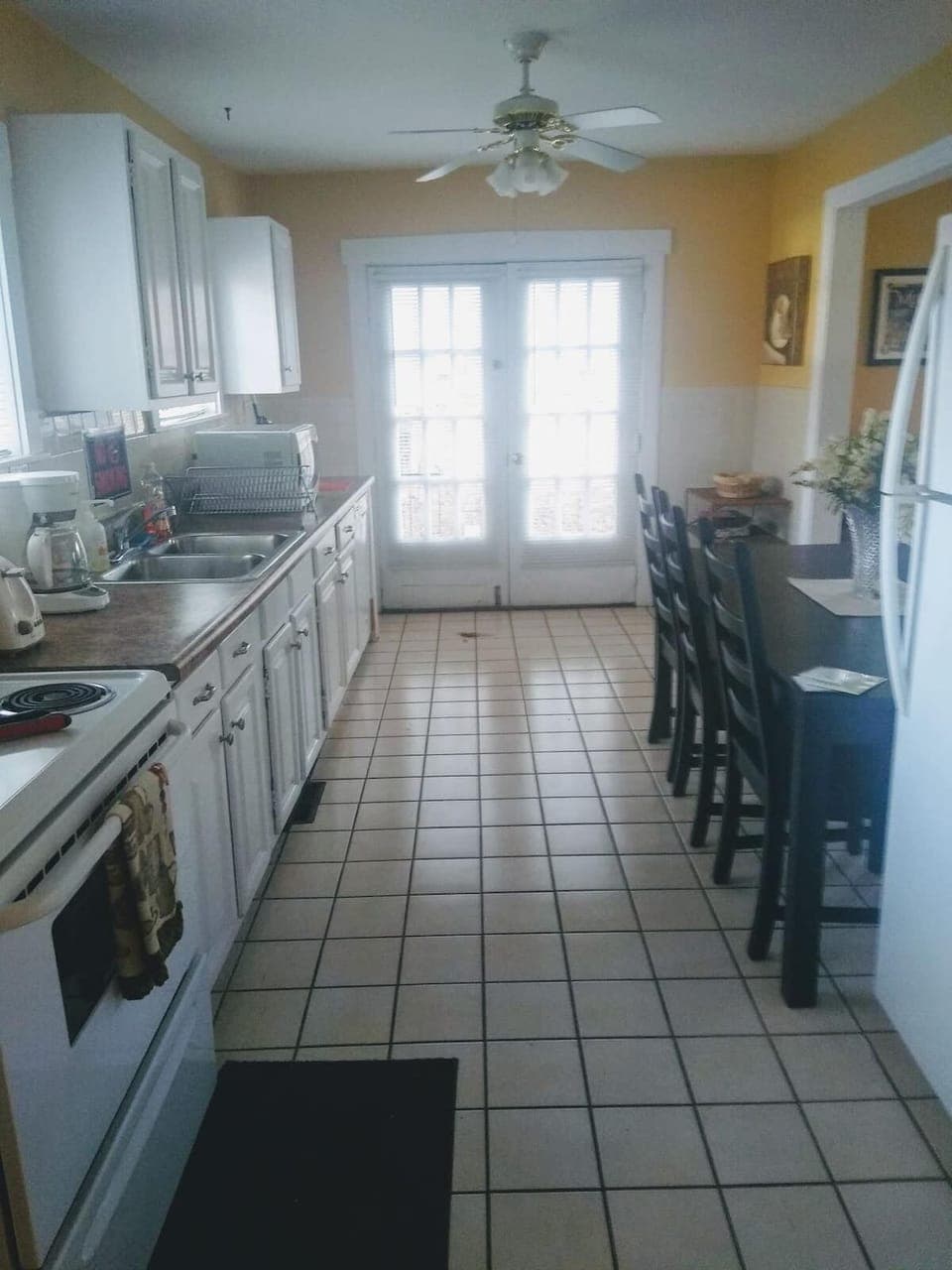 Large kitchen is fully stocked with pots, pans, dishes and utensils! 