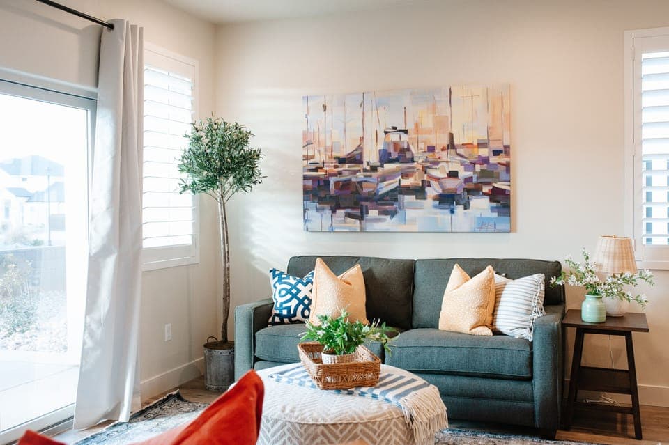 Comfortable living space with natural light, cozy seating, and sliding door access.