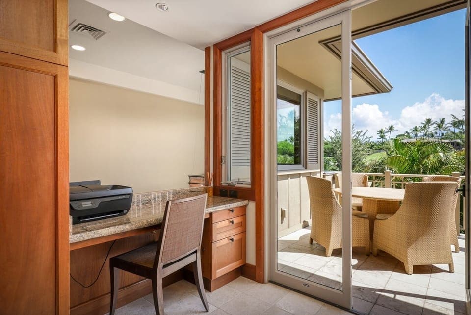 Built-in desk and a lovely breakfast balcony overlooking the immaculate courtyard.