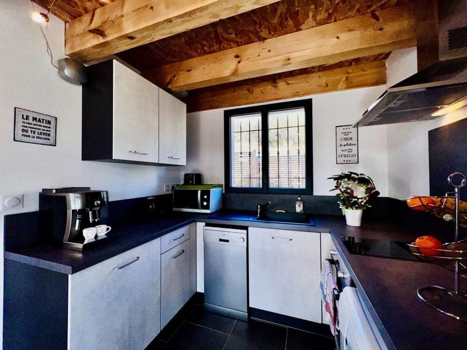 equipped kitchen and its Delonghi espresso grinder coffee maker