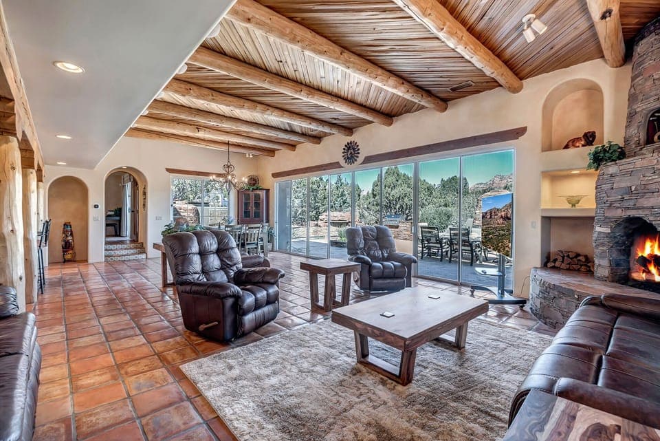 Great Room with Tile Floors and a Wood Beam Ceiling