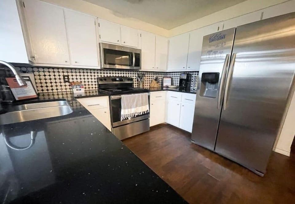 Fully stocked kitchen with full sized appliances