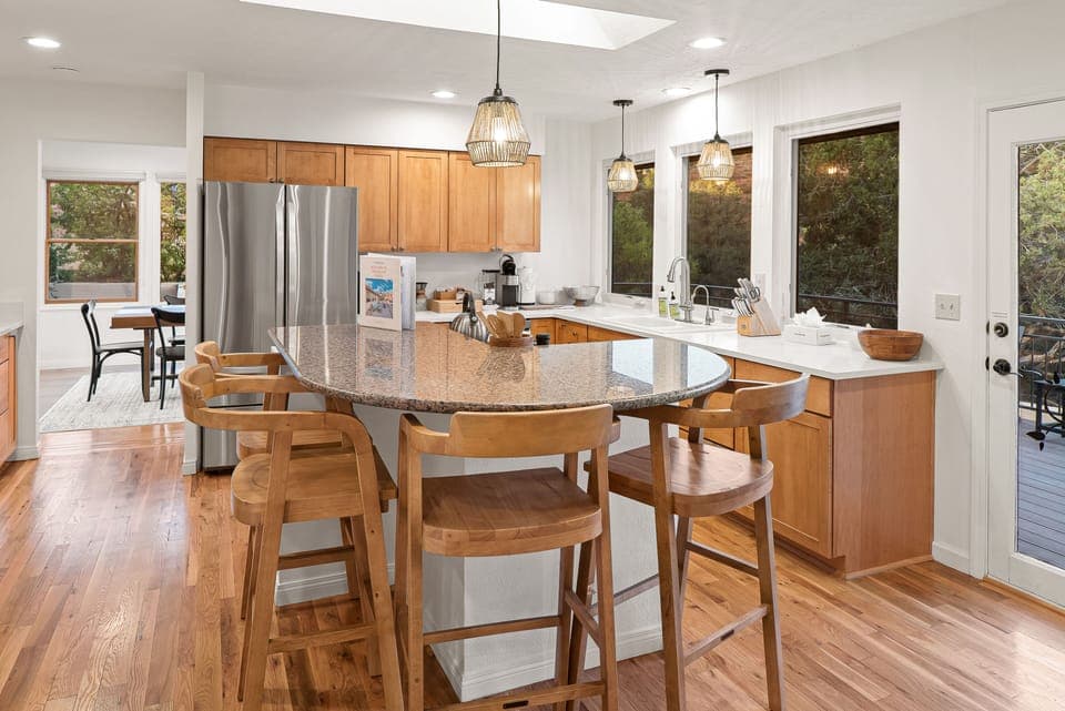 Fully Equipped Kitchen w/ Center Island & Dining Area in Background