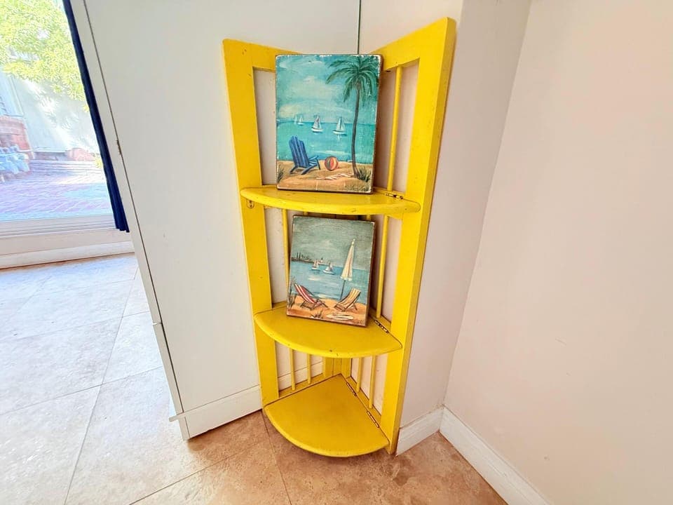 Bright yellow corner shelf to your stay