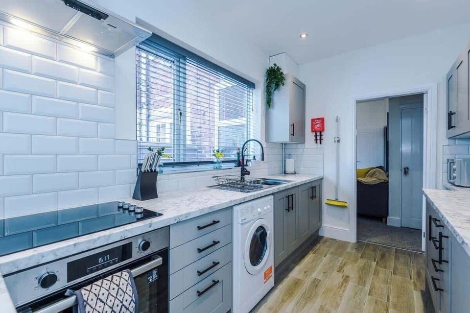 The fully equipped open plan kitchen/dining area has everything you need for a short and long term stay in Crewe. 