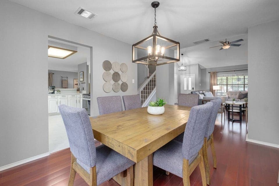 Spacious, fenced backyard with playset and seating makes Boni and Blithe ideal for families and pets.