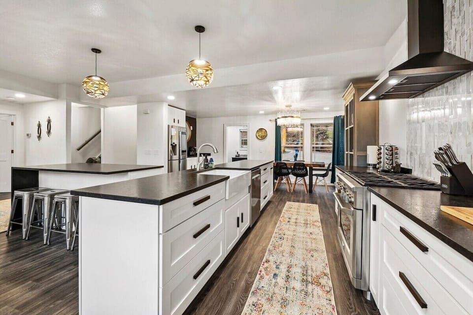 This open-concept space boasts stunning modern design, colorful accents and huge windows overlooking Beaver Lake.