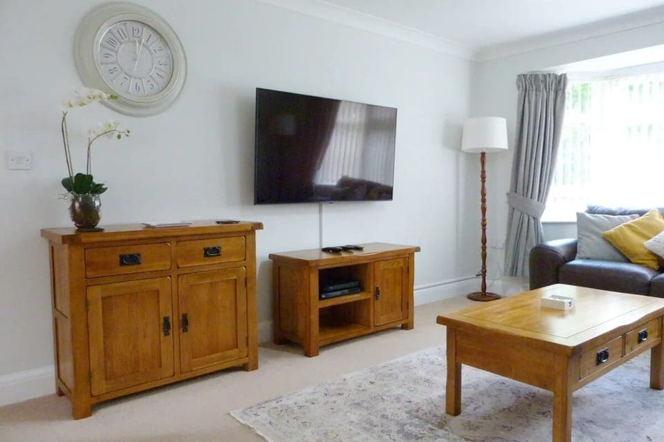 Lounge with 55" Ultra HD smart TV with Netflix and iPlayers and leather sofas.