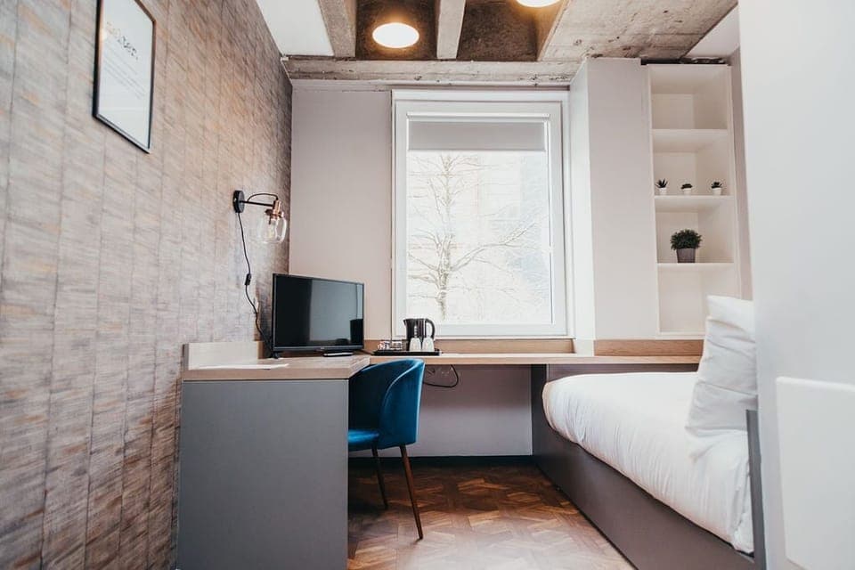 Economy Room | Blackout drapes, free WiFi, bed sheets