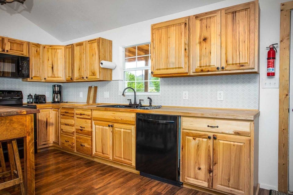 The roomy and full kitchen includes not only modern appliances, but dishes, utensils, and cooking ware for easy meal preparation.