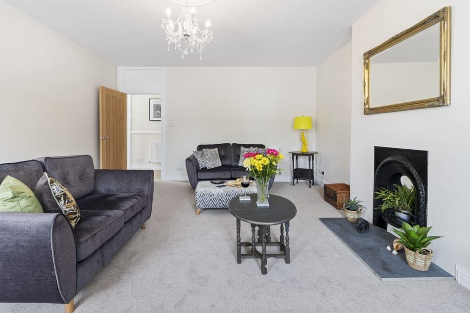 This beautifully presented lounge with two 2 seater sofas, cosy armchair and feature fireplace is the perfect place for you to relax after a long day sight seeing.