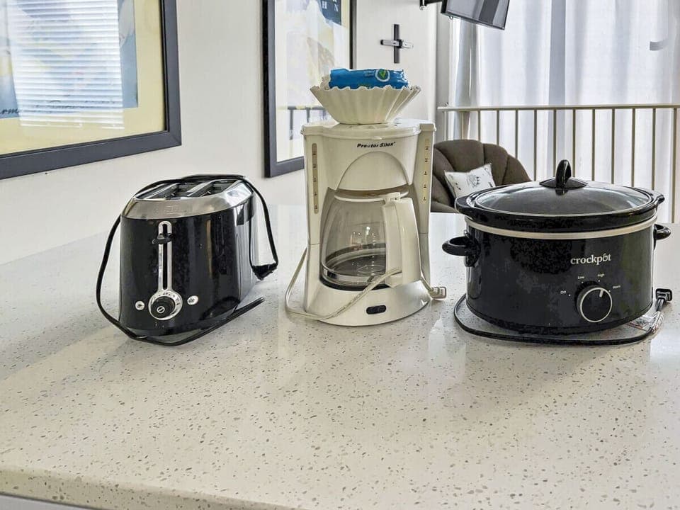 Remodeled kitchen is fully-equipped with pots, pans, & utensils.