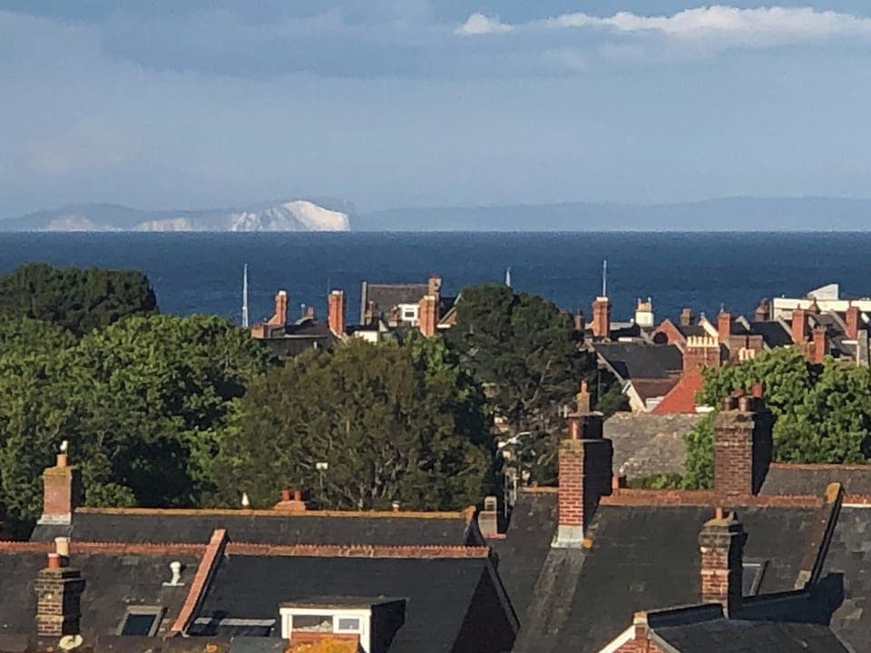 View over the rooftops to the Isle of White | The Old Stone House, Swanage