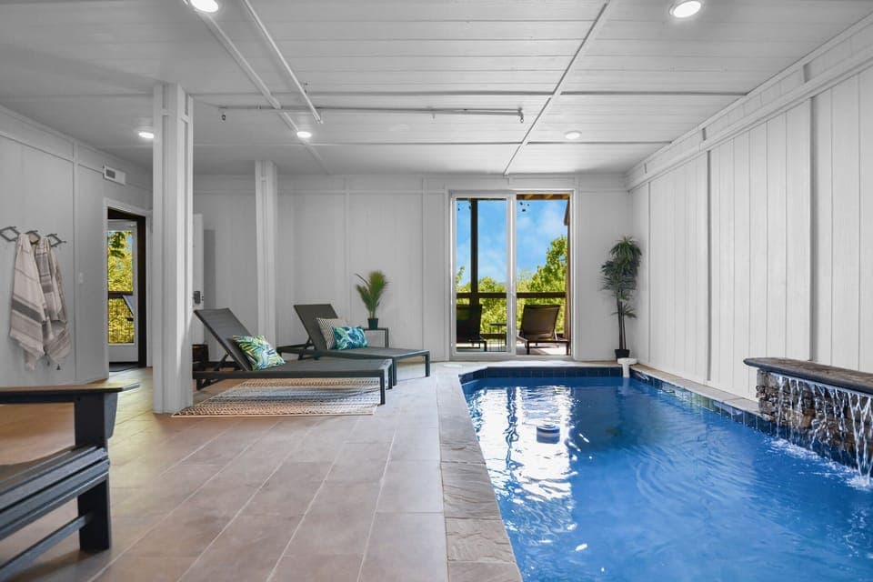 Private indoor pool in luxury Smoky Mountains cabin—perfect year-round relaxation for families and groups.