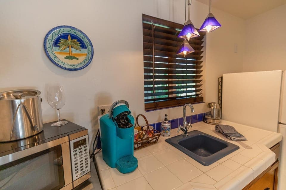 Deluxe Studio Suite, 1 King Bed, Pool View | Private kitchenette | Fridge, microwave, coffee/tea maker, toaster