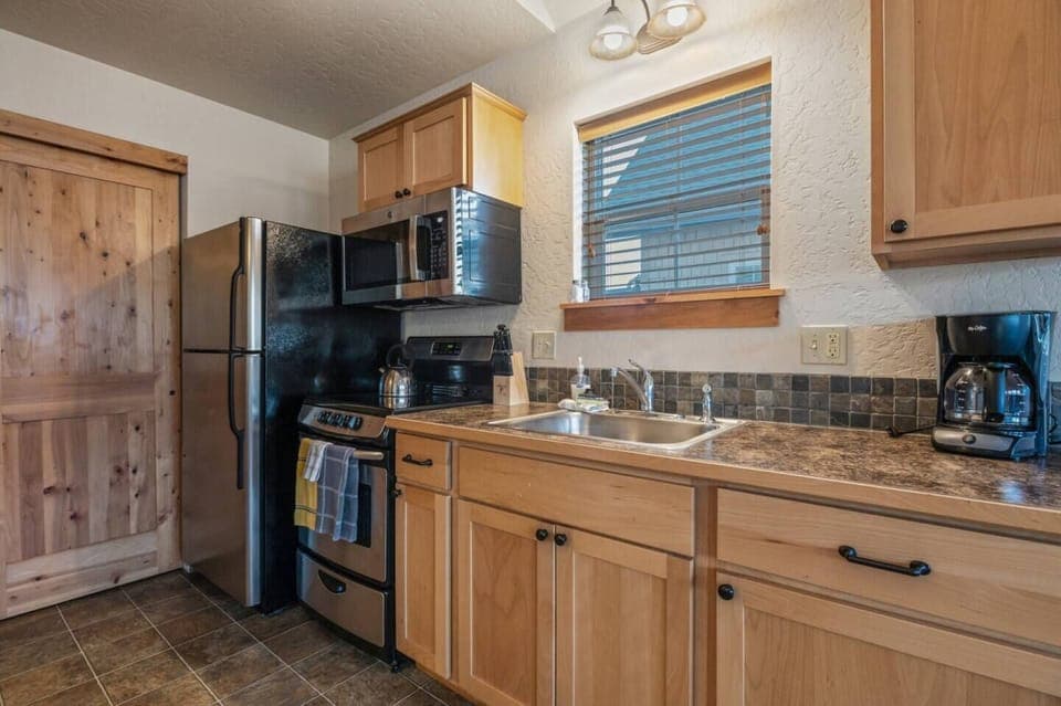 Enjoy cooking a delicious meal in this delightfully detailed kitchen.