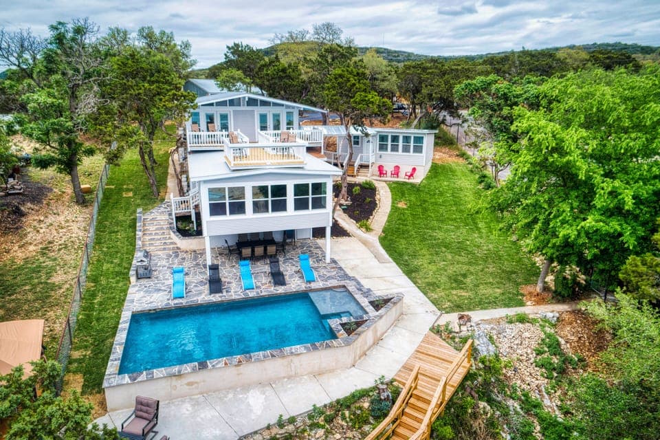 House sleeps 20 people. Roof top decks, lake views & poolside dining with BBQ.