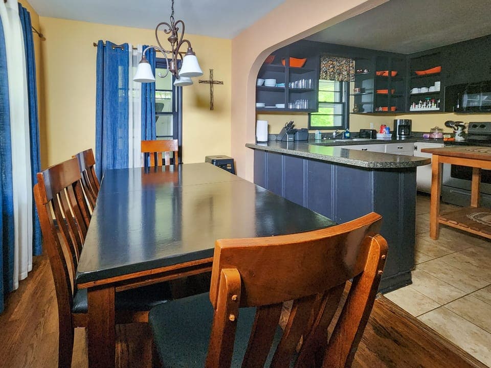 Long table accommodates all of the family. Perfect for large meal or games.