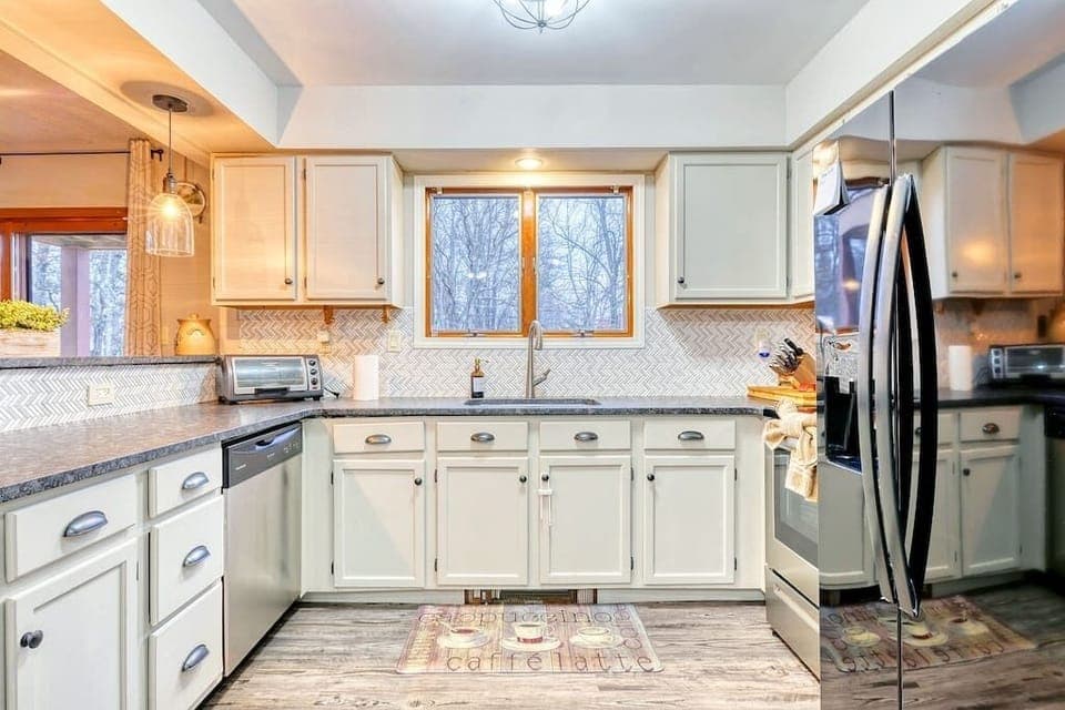 Kitchen | As you enter the home your are greeted by our fully stocked kitchen for all your cooking needs, just bring groceries and begin to entertain