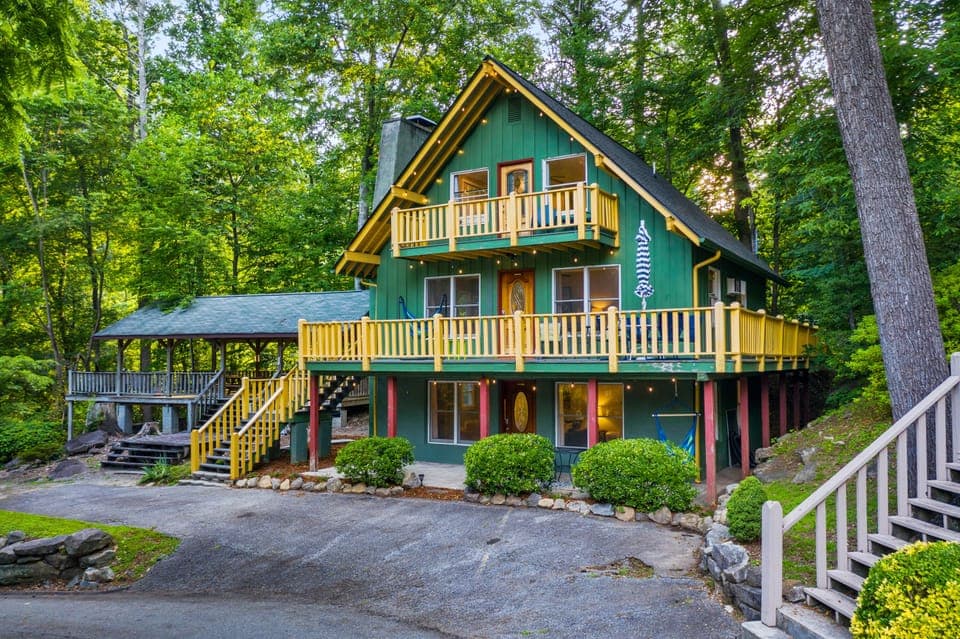 Welcome to Chimney Summit Chalet, on the second and third floors of Chimney Chalet, accessible via the yellow stairs to the left. Relax on the porch and listen to the sounds of the Broad River while gazing at Chimney Rock State Park.