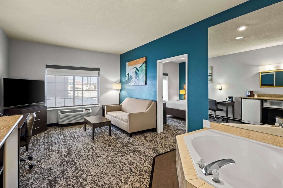 Suite, 1 King Bed, Non Smoking, Jetted Tub (Living Room;with Sofabed) | Pillowtop beds, in-room safe, desk, laptop workspace