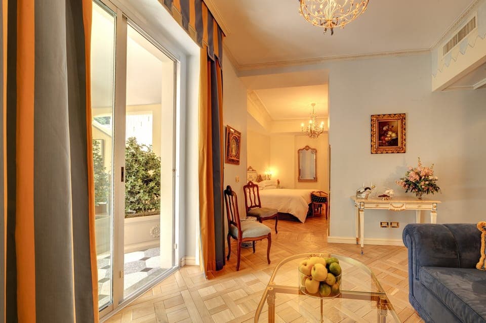 Junior Suite, Garden View | Living room | 42-inch flat-screen TV with satellite channels, TV