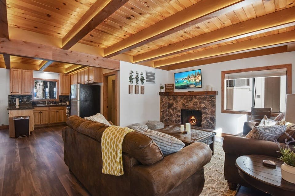 Cozy Living Space with Roku TV & Fireplace backs into Open Kitchen