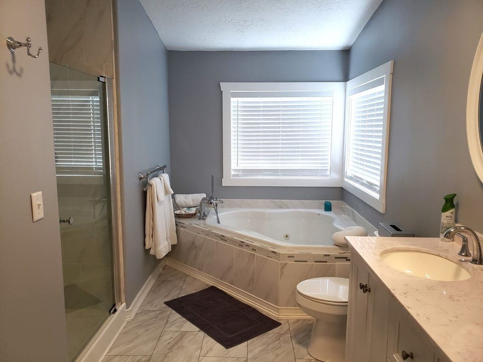 Main bath full view of separate tub and shower