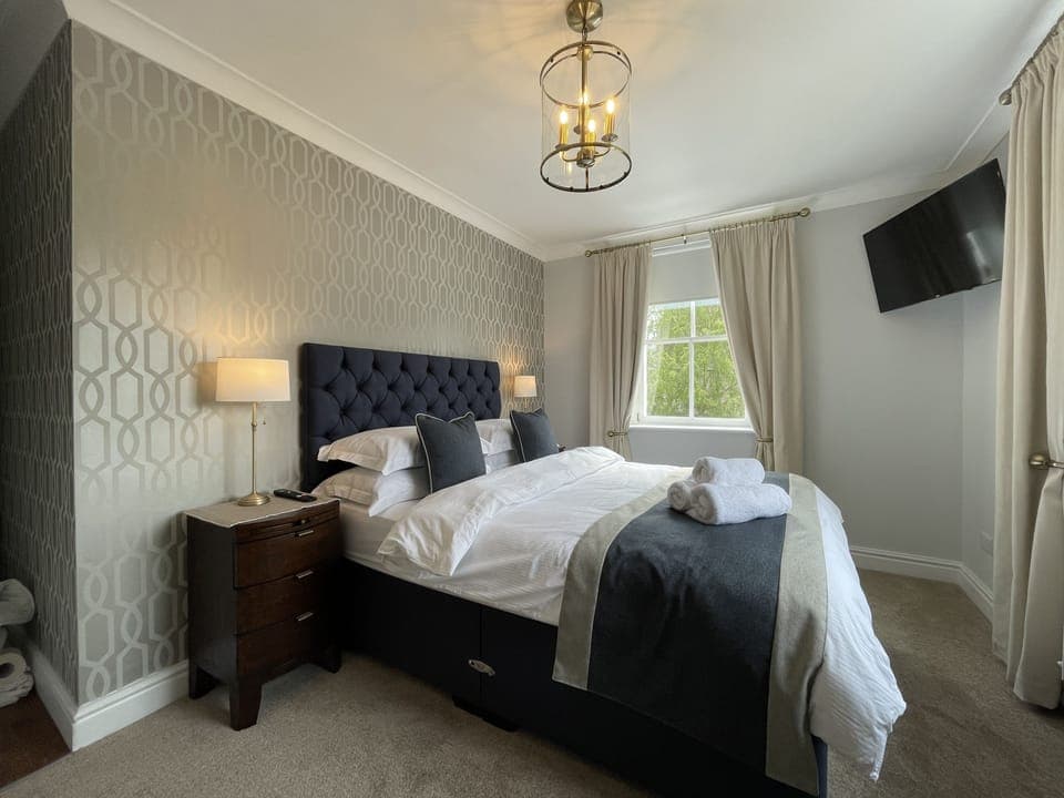 The master bedroom on the corner of the property