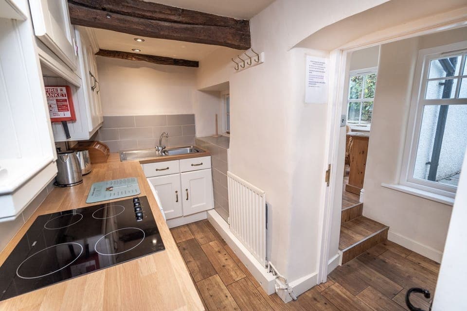 The compact kitchen is beautifully decorated and functional