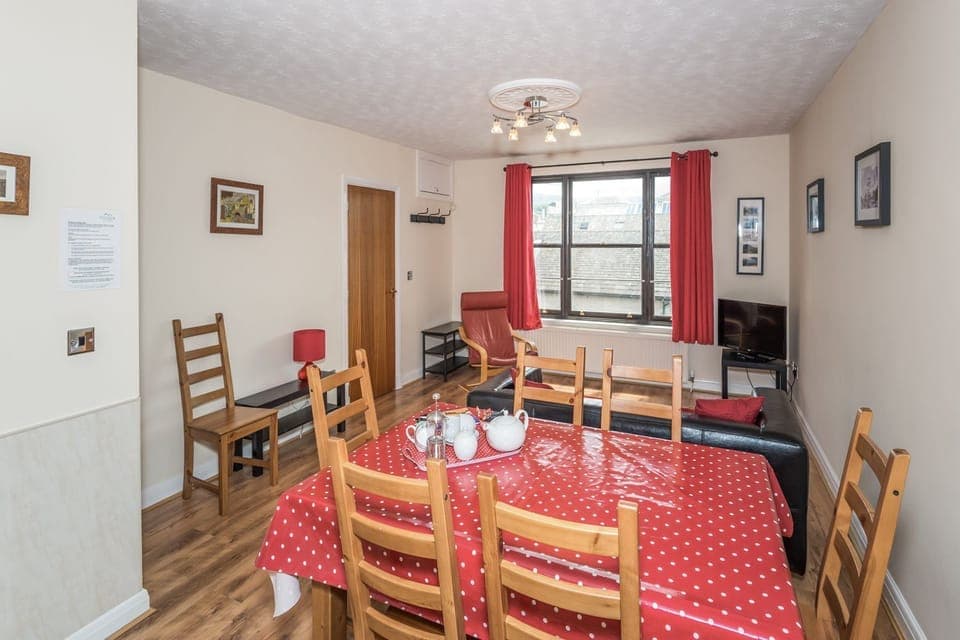 This room is the perfect space for everyone to gather and have dinner or play a game