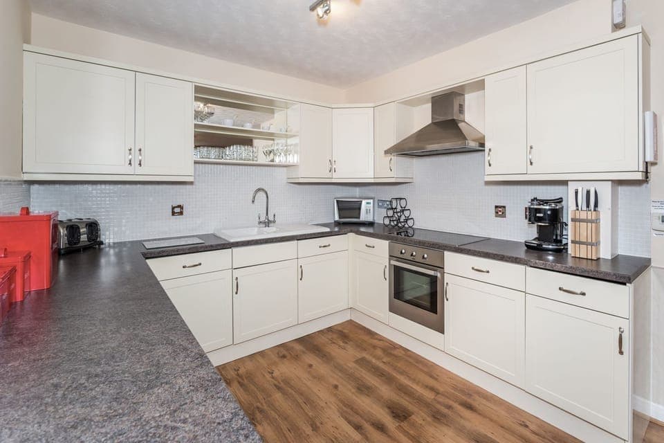 The kitchen is equipped with  ceramic hob, oven, fridge, freezer, dishwasher, washing machine and lots of cupboard space