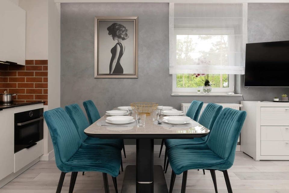 Large table with chairs for eating communal meals. 