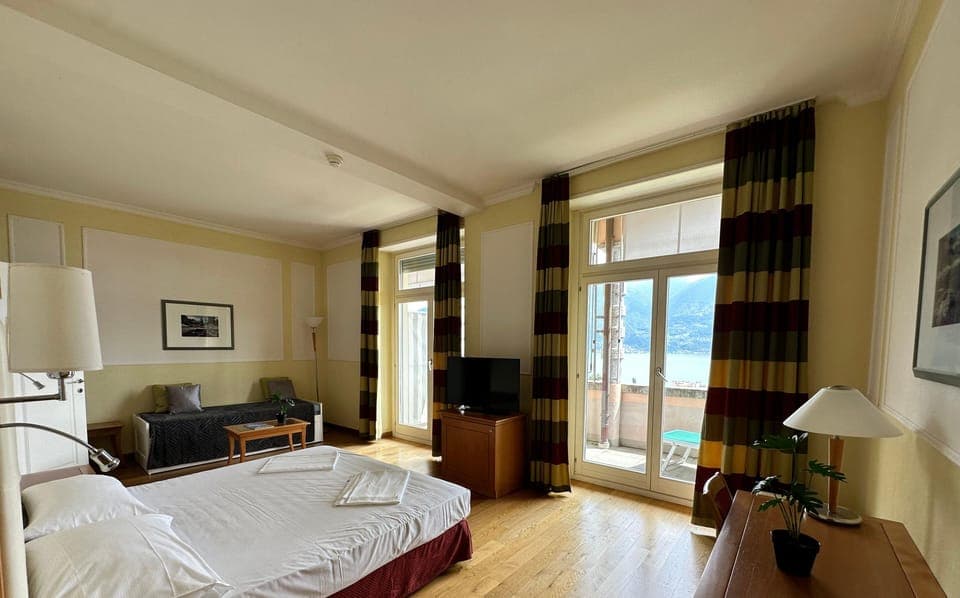 Panoramic Quadruple Room, Lake View | Desk, free WiFi, bed sheets