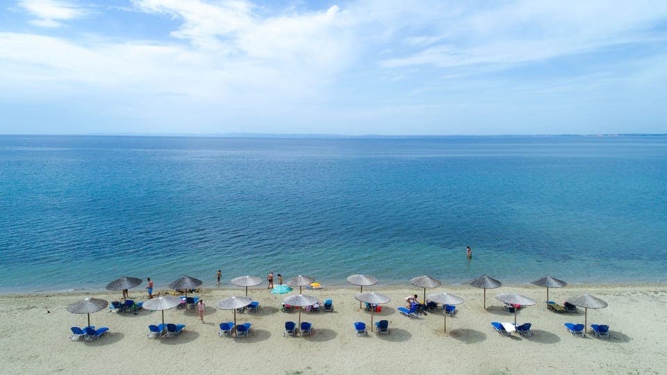 On the beach, sun loungers, beach towels, snorkeling