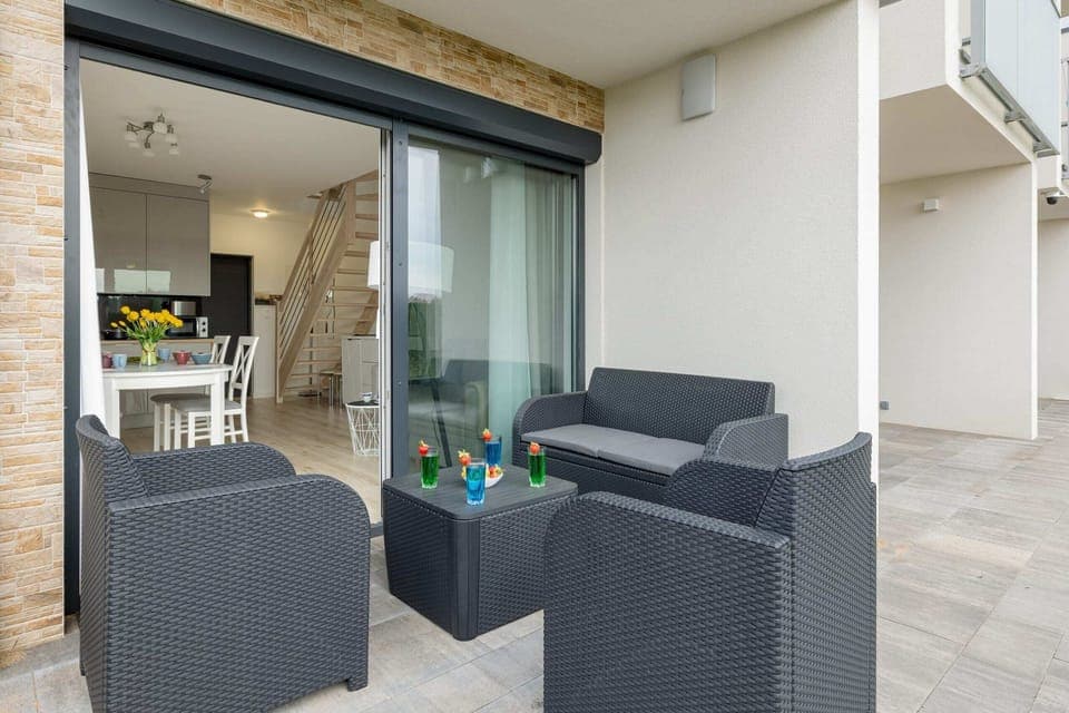 Spacious terrace with outdoor furniture. 