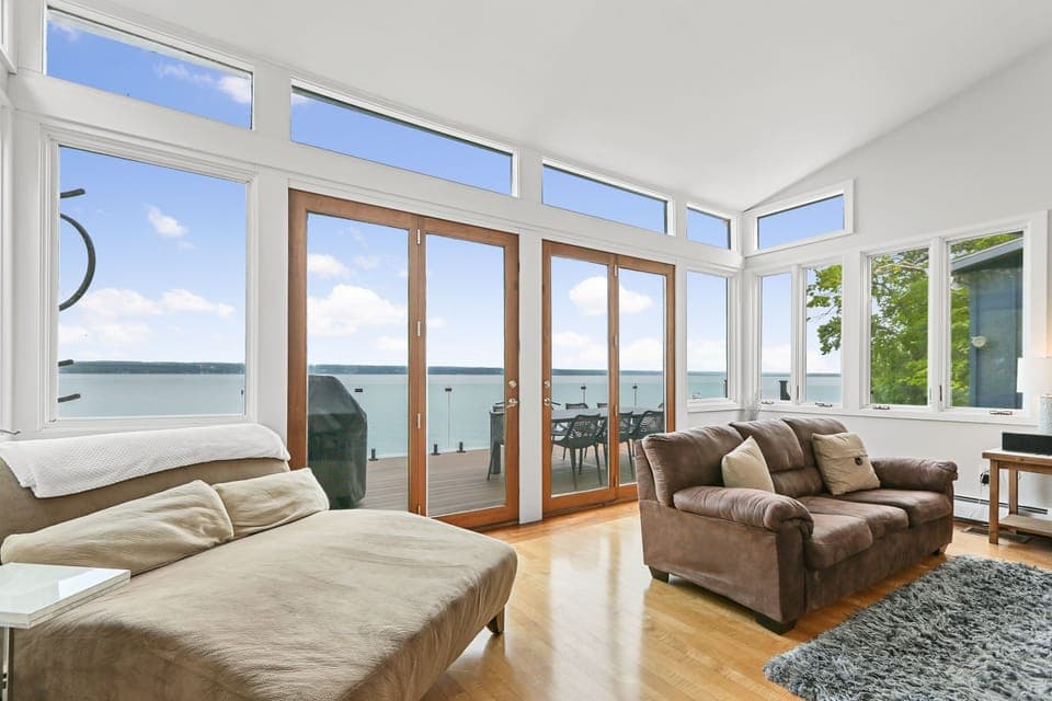Huge Living Room sitting area connects to the deck & the kitchen w/ great views