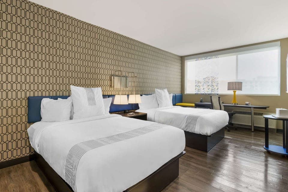 Standard Room, 2 Queen Beds, Non Smoking, Refrigerator & Microwave (Shower Only) | Desk, laptop workspace, bed sheets