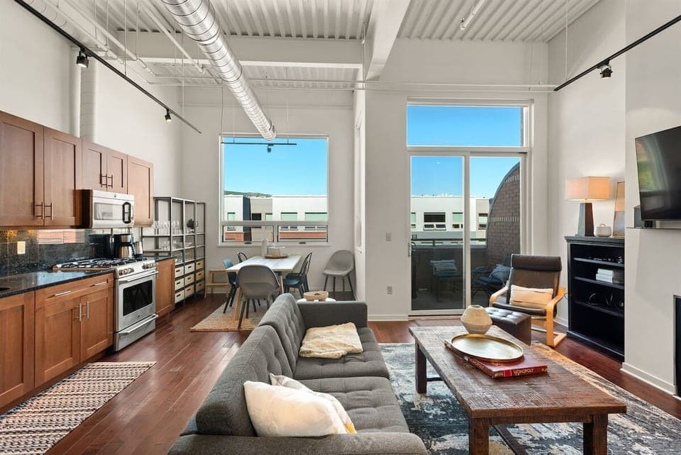 Spacious and professionally-decorated, open-concept living/dining/kitchen