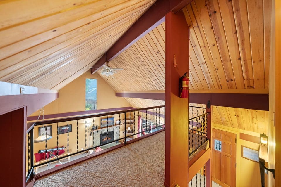 The home features stunning vaulted ceilings adorned with rustic - The home features stunning vaulted ceilings adorned with rustic knotty pine.