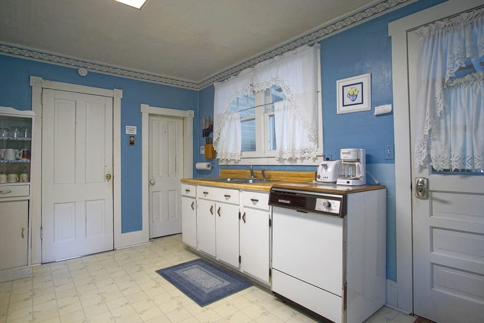 Intimate and character-rich, this kitchen offers an authentic glimpse into the home's earlier days.