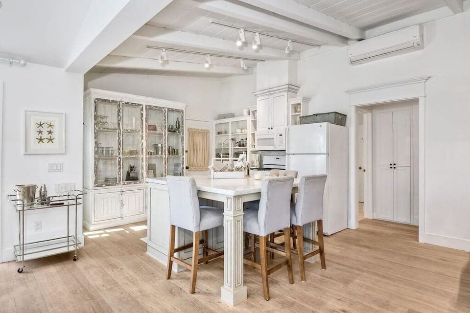 Kitchen with island in center.  Lots of room and seating.