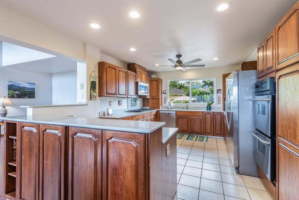 Enjoy cooking in the wide and open, fully equipped kitchen with stainless steel appliances and generous counter space designed for group meals.