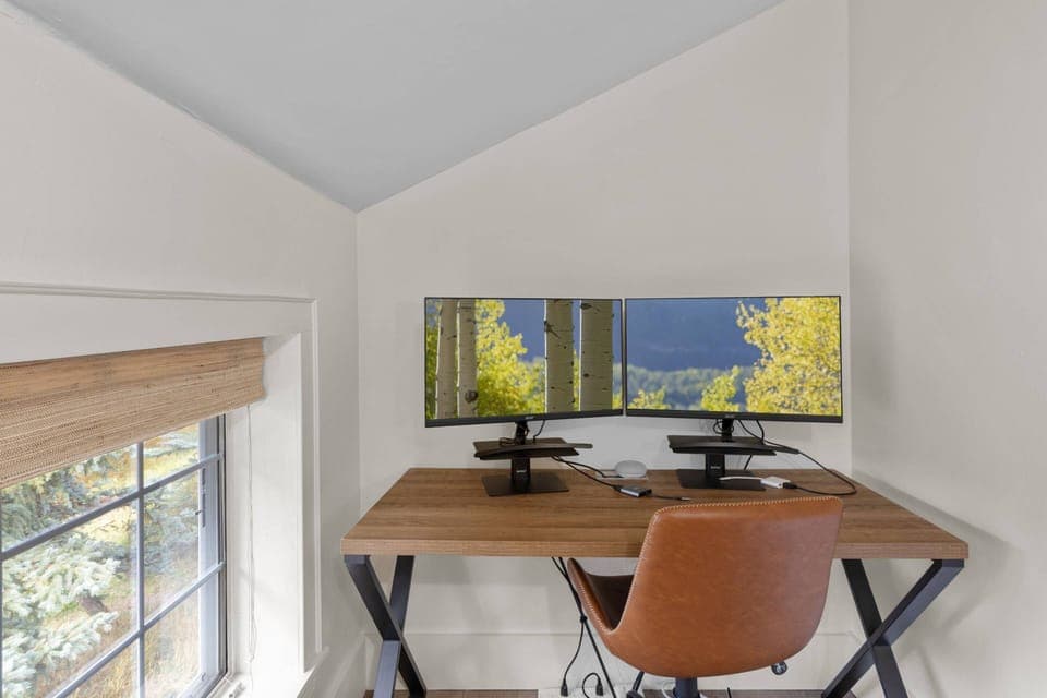 Separate work space with dual monitors located in the primary ensuite
