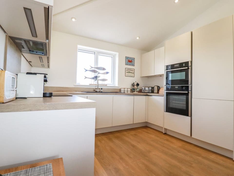 Fridge, electric kettle, toaster, cookware/dishes/utensils