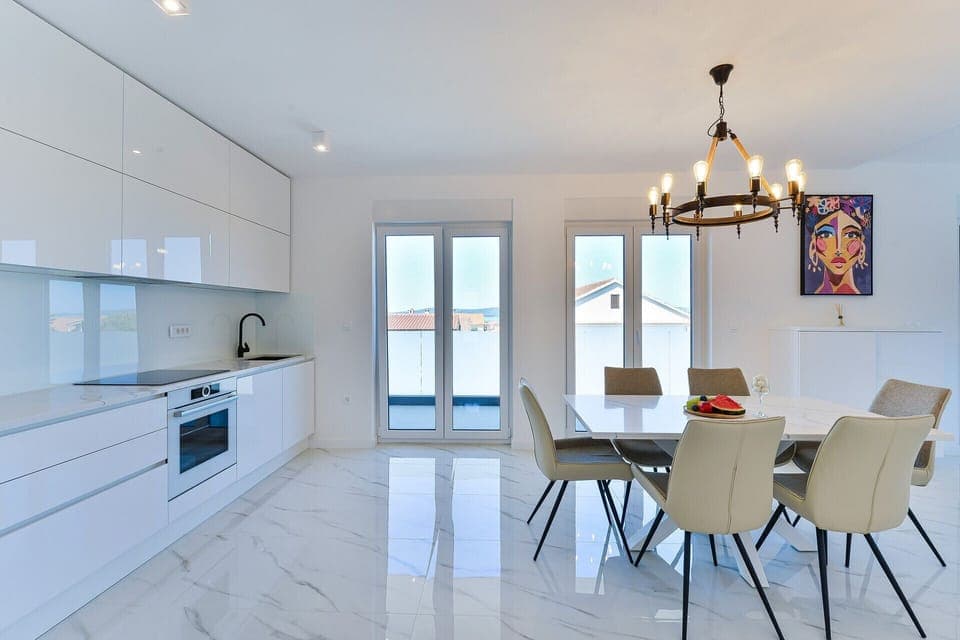 Beautiful open concept living area with exit to the balcony