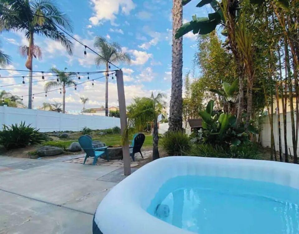 Hot tub, fire pit, and big, relaxing back yard